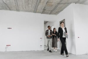 real estate agent showing couple a room